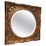 Miroir en bois doré avec détails ornementaux