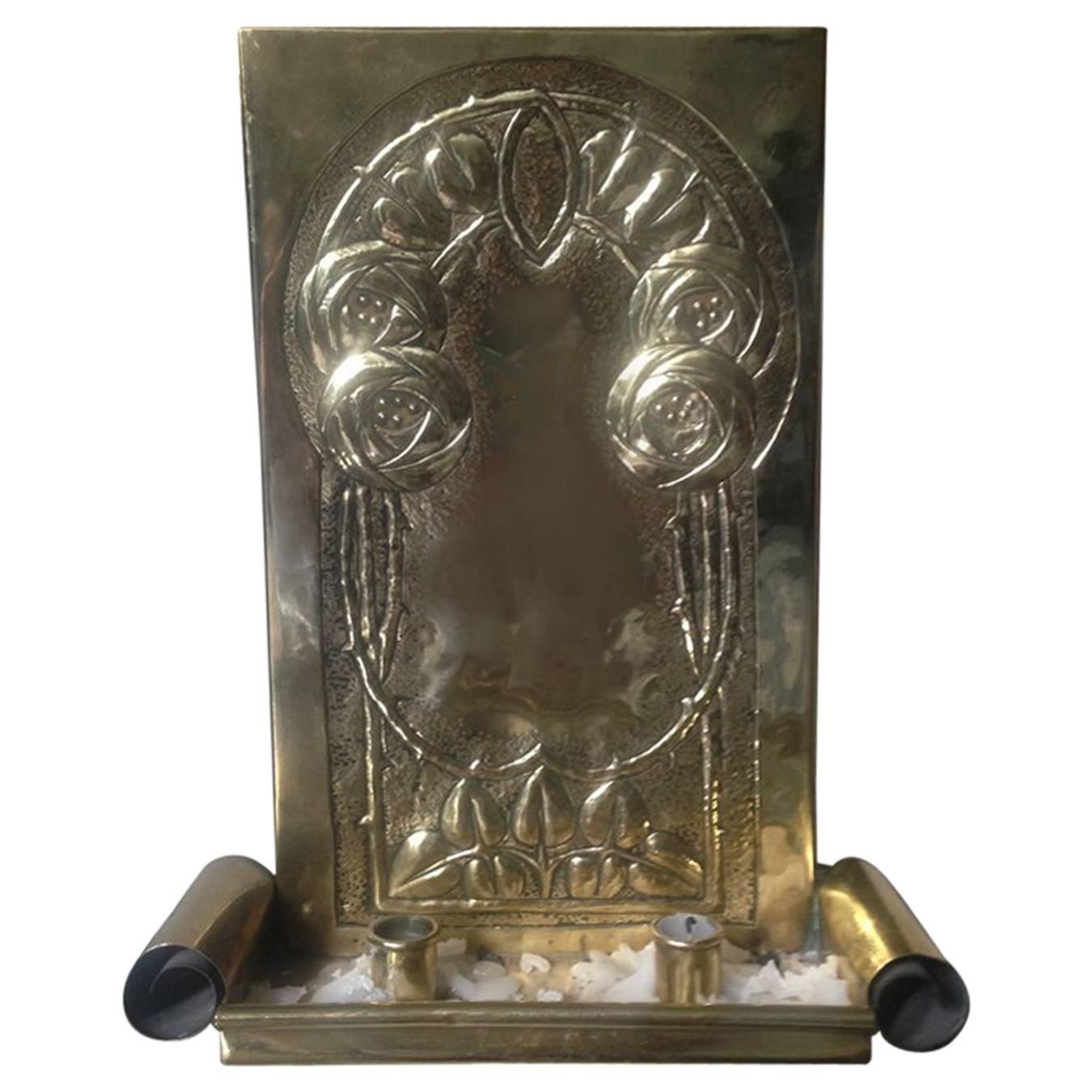 A Glasgow School Brass Candle Sconce With Stylised Glasgow Roses & Scroll Detail