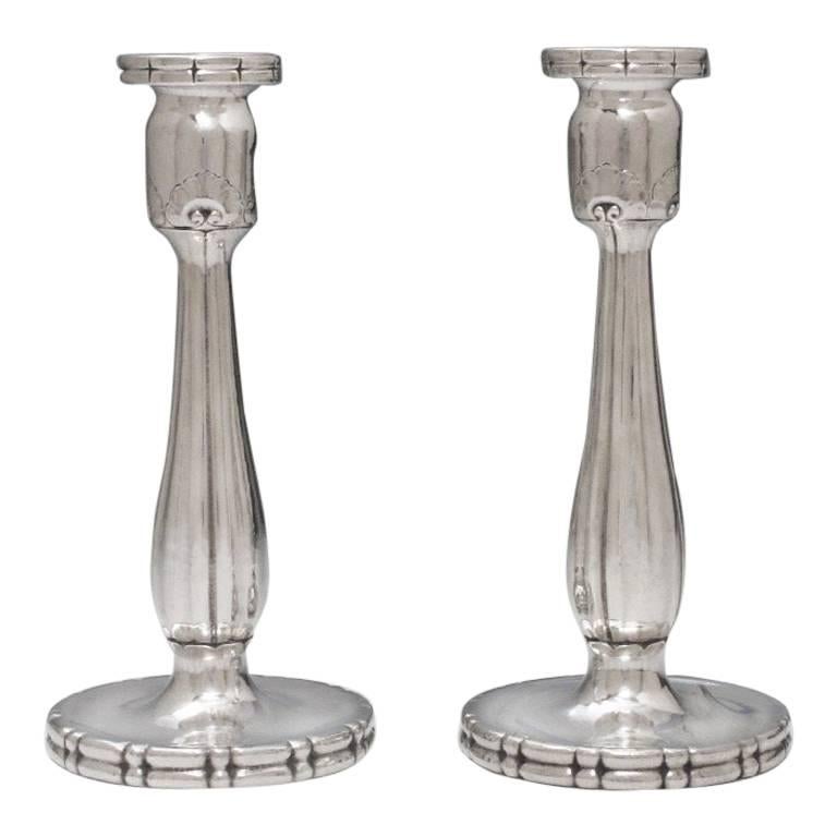 Pair of Arts & Crafts Silver Candlesticks by Georg Jensen For Sale