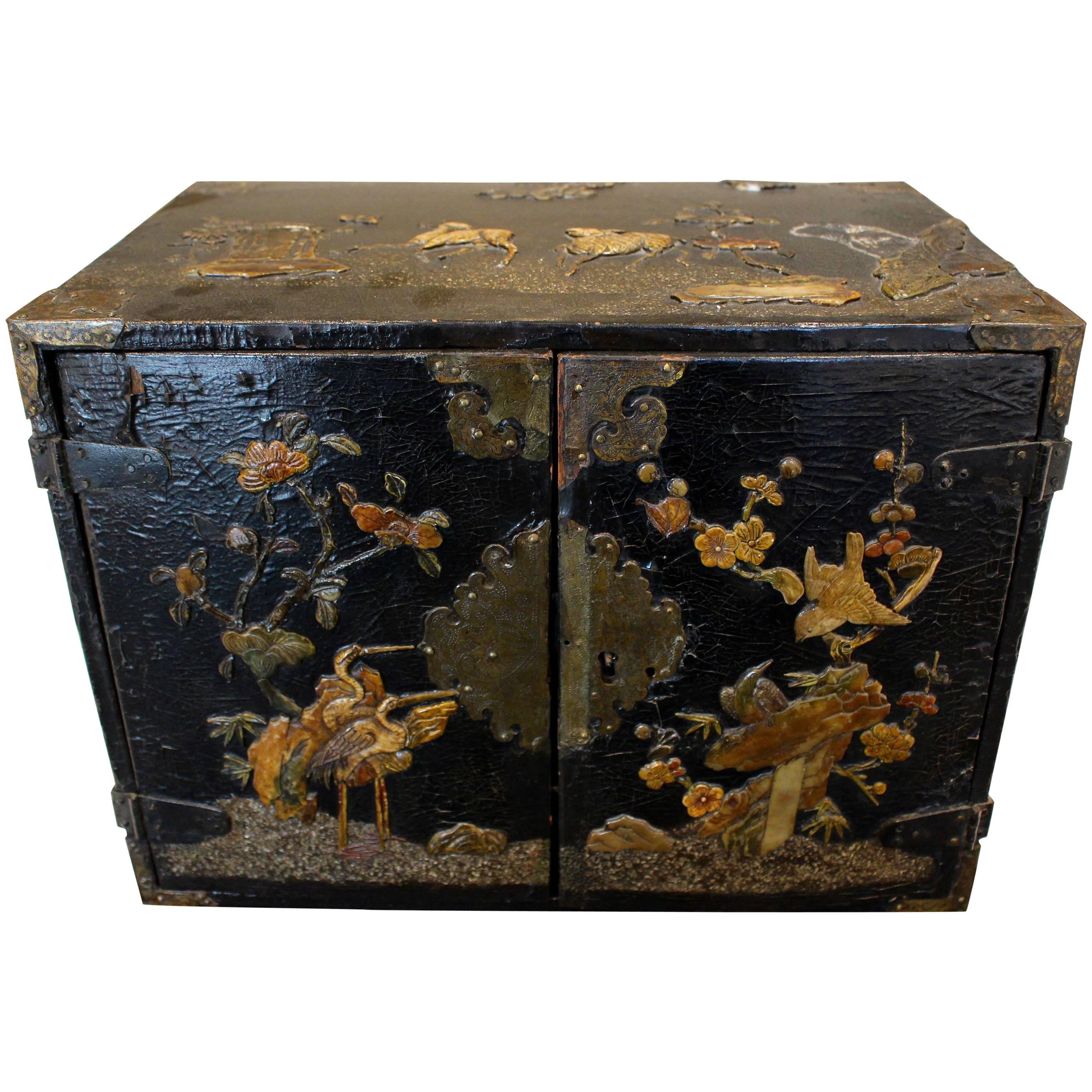 Small Chinese Black Lacquered Wood Cabinet with Raised Traditional Scenery For Sale