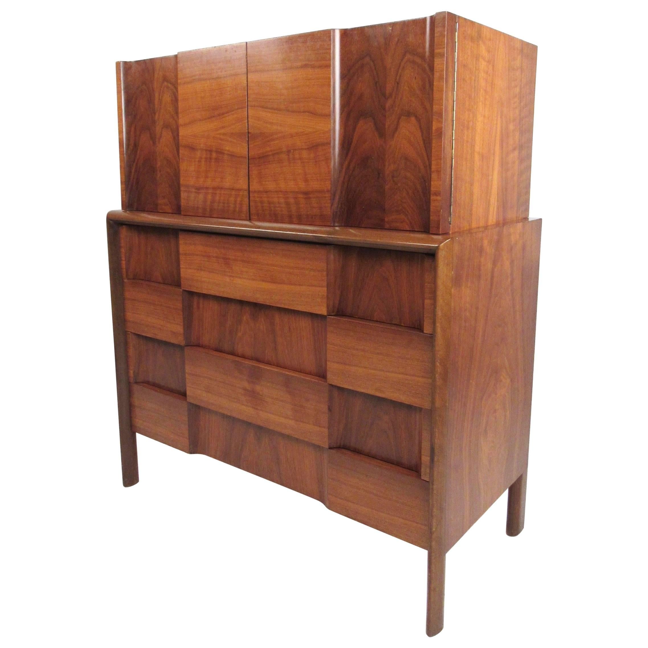 This Edmond Spence designed midcentury dresser features stunning marquetry combined with carefully sculpted 