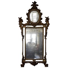Grand miroir italien sculpté et doré de style Louis XV