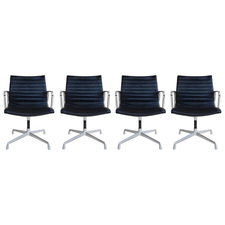 Eames Aluminum Group Office Chairs with Ribbed Leather Slings at 1stDibs