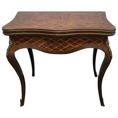 19th Century French Parquetry and Gilt Serpentine Fronted Fold over Games Table