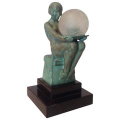 Bronze Art Déco, femme assise avec globe électrifié de Max Le Verrier