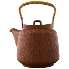 Jens Quistgaard: Teapot in Fired Chamotte Clay with Handle of Cane