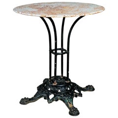 Antique French Iron Bistro Table with Painted Top and Paw Foot Cast Iron Base circa 1890