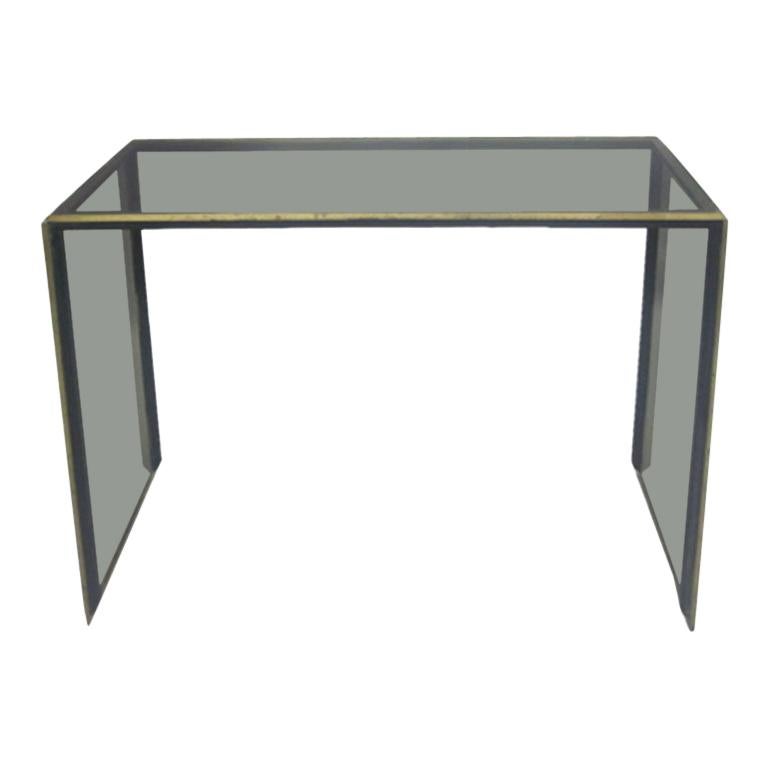 Elegant, sober and beautiful Minimalist Italian Mid-Century Modern console, sofa table or writing table, attributed to Romeo Rega. The delicate frame is conceived in a subtle combination of brass and nickel. The glass sides and top are in a subtle