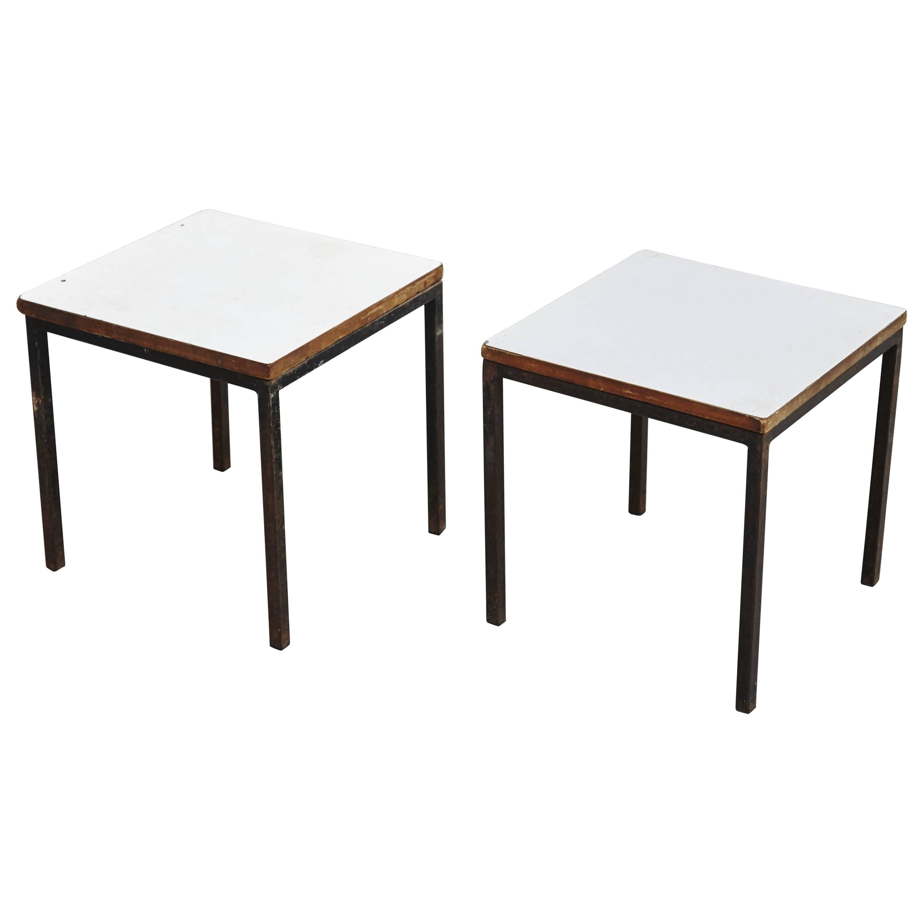 A pair of T-angle side tables designed by Florence Knoll and manufactured by Knoll. 
Metal legs and formica tabletops. 

In good original condition, with minor wear consistent with age and use.

Florence Knoll Bassett is an American architect