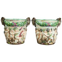 Pair of Figural Capodimonte Hand-Painted Open Urns with Cupids, Crown N Mark