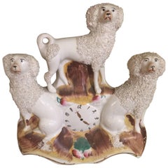 Trio of Staffordshire Spaniels on Faux Clock