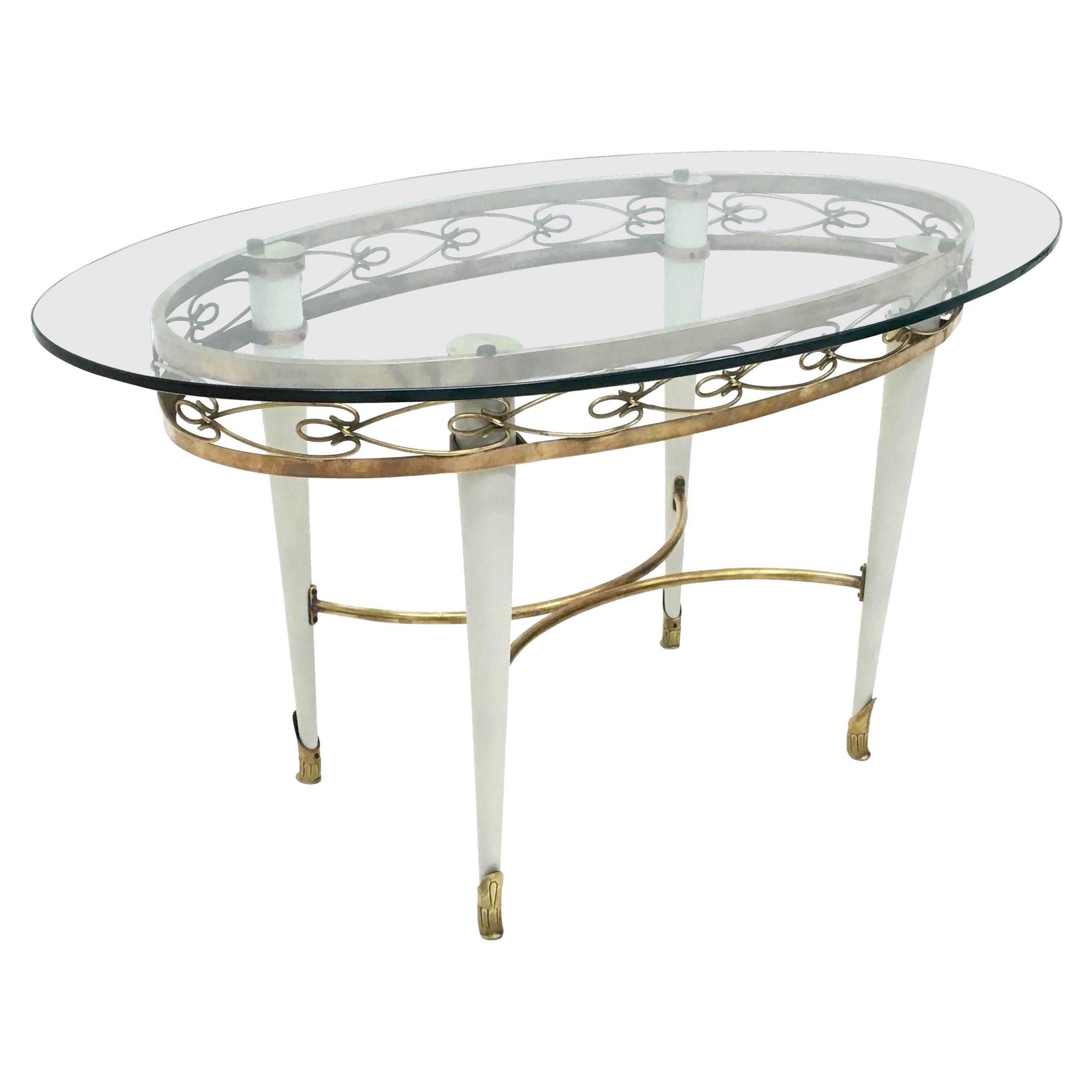 Brass Coffee Table with an Oval Glass Top in the Style of Pierluigi Colli, Italy For Sale