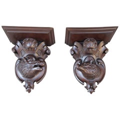 Pair of 19th Century German Black Forest Carved Walnut Wall Brackets