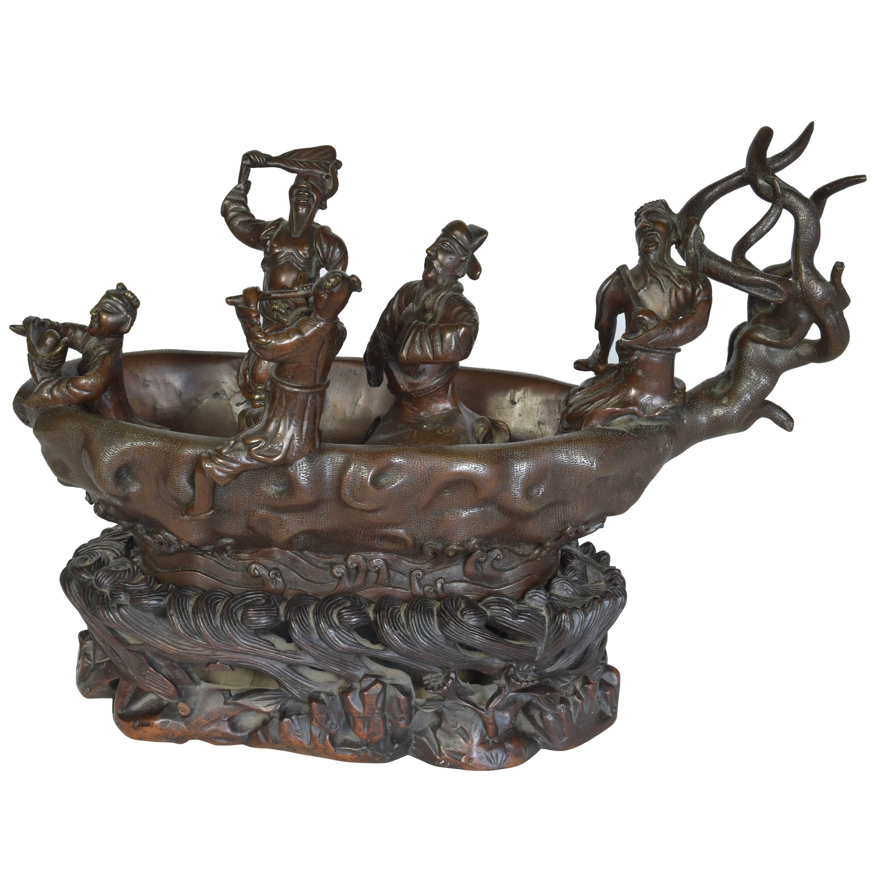 Cast Bronze Sculpture of Men in a Boat on a Carved Wooden Base, Signed For Sale