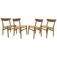 Set of Four Hans Wegner CH-23 Dining Chairs in Cane, Teak and Oak, circa 1950s