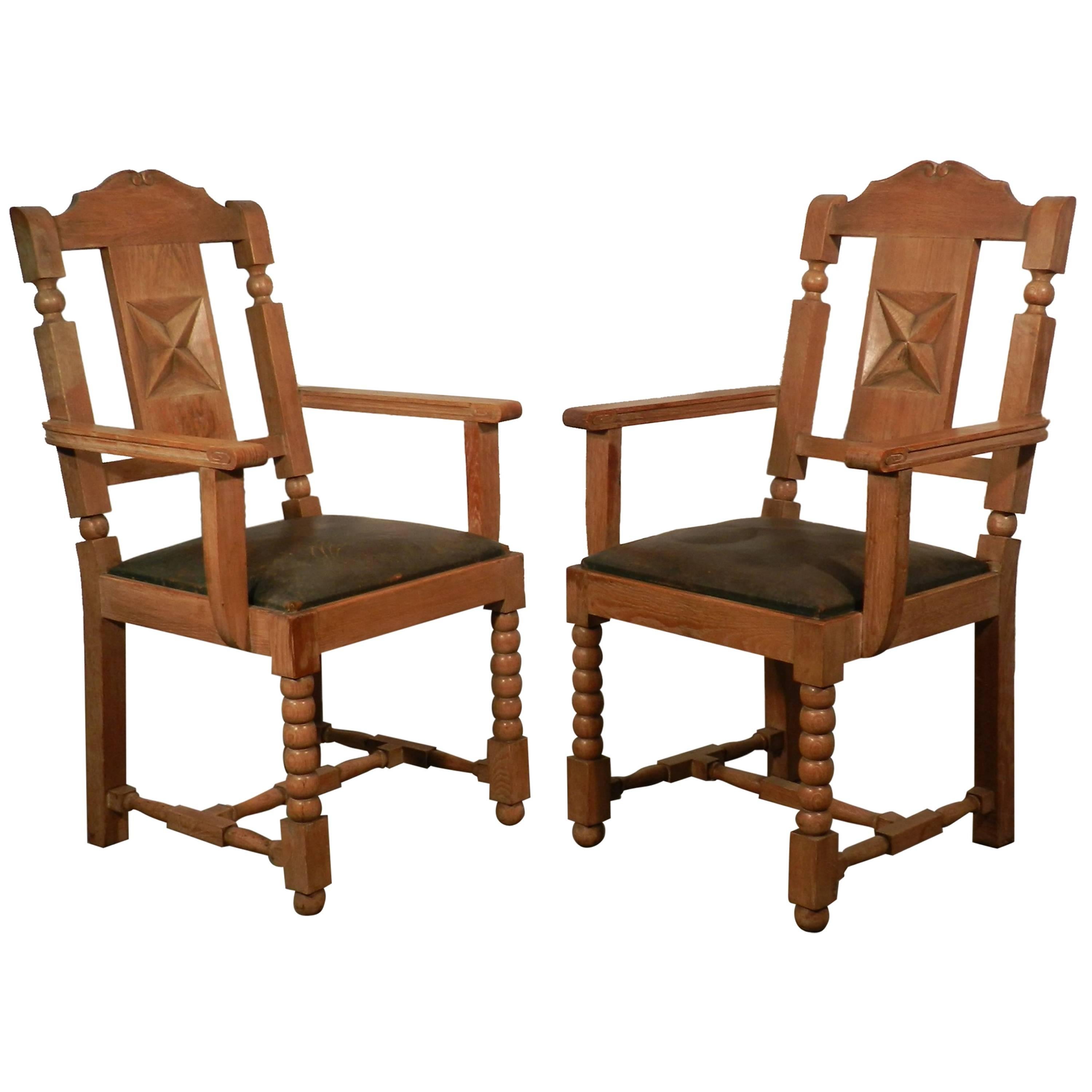 In the Style of Charles Dudouyt, two  Neo Rustique Oak Armchairs