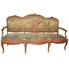 Sillón Luis XV del siglo XVIII en madera de frutal con tapicería de aubusson