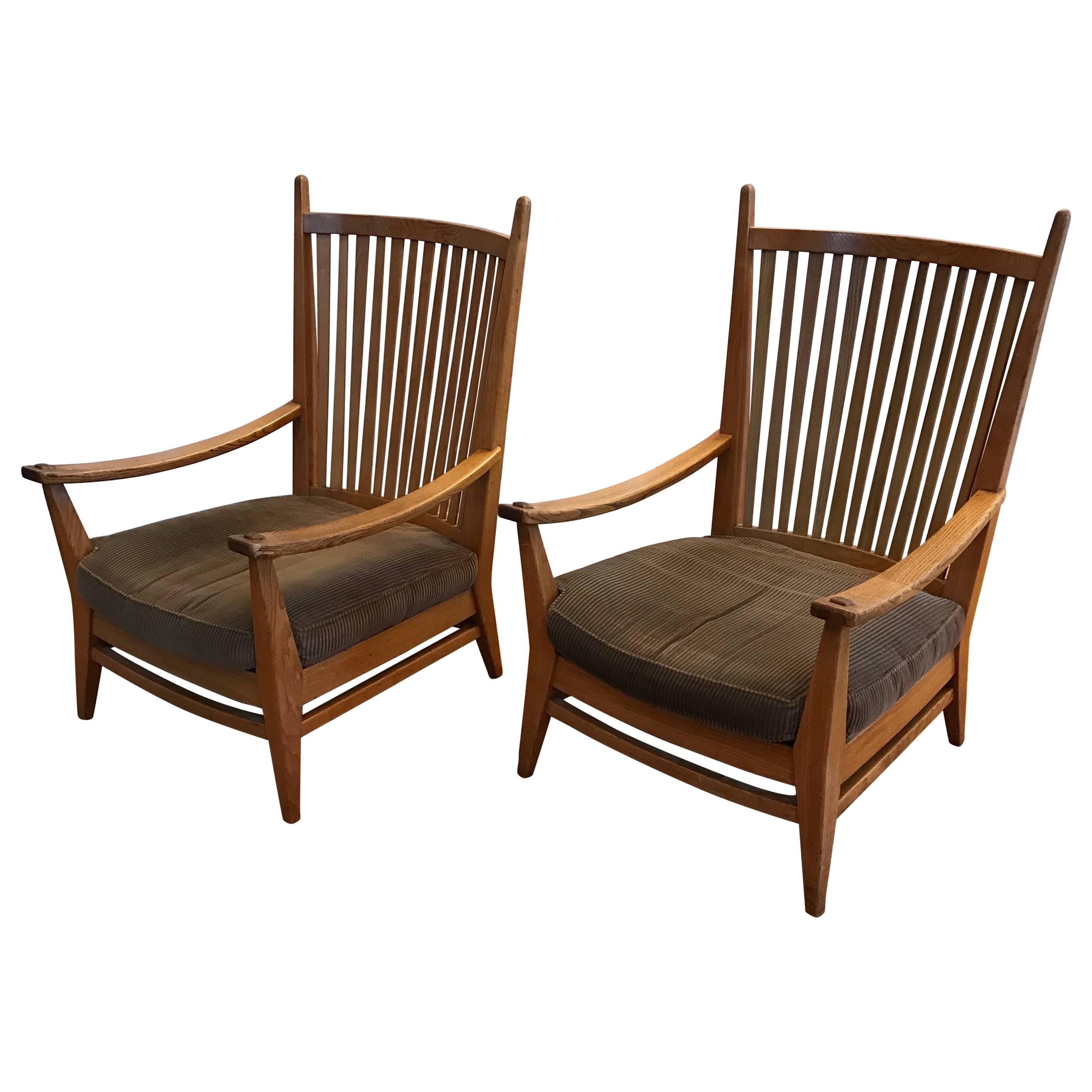 Dutch Arts and Crafts design, elegant oak lounge chairs.

These very stylish chairs are made by Dutch design icon Bas Van Pelt and they are in excellent condition. The handcrafted oak frame and the high backs give these chairs lots of character.