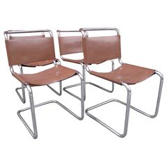 Four Cantilever Chrome and Leather Chairs