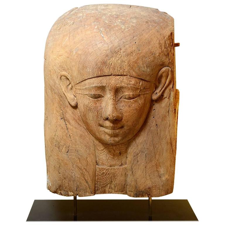 Fragment of an Egyptian Wooden Sarcophagus Depicting a Head For Sale at