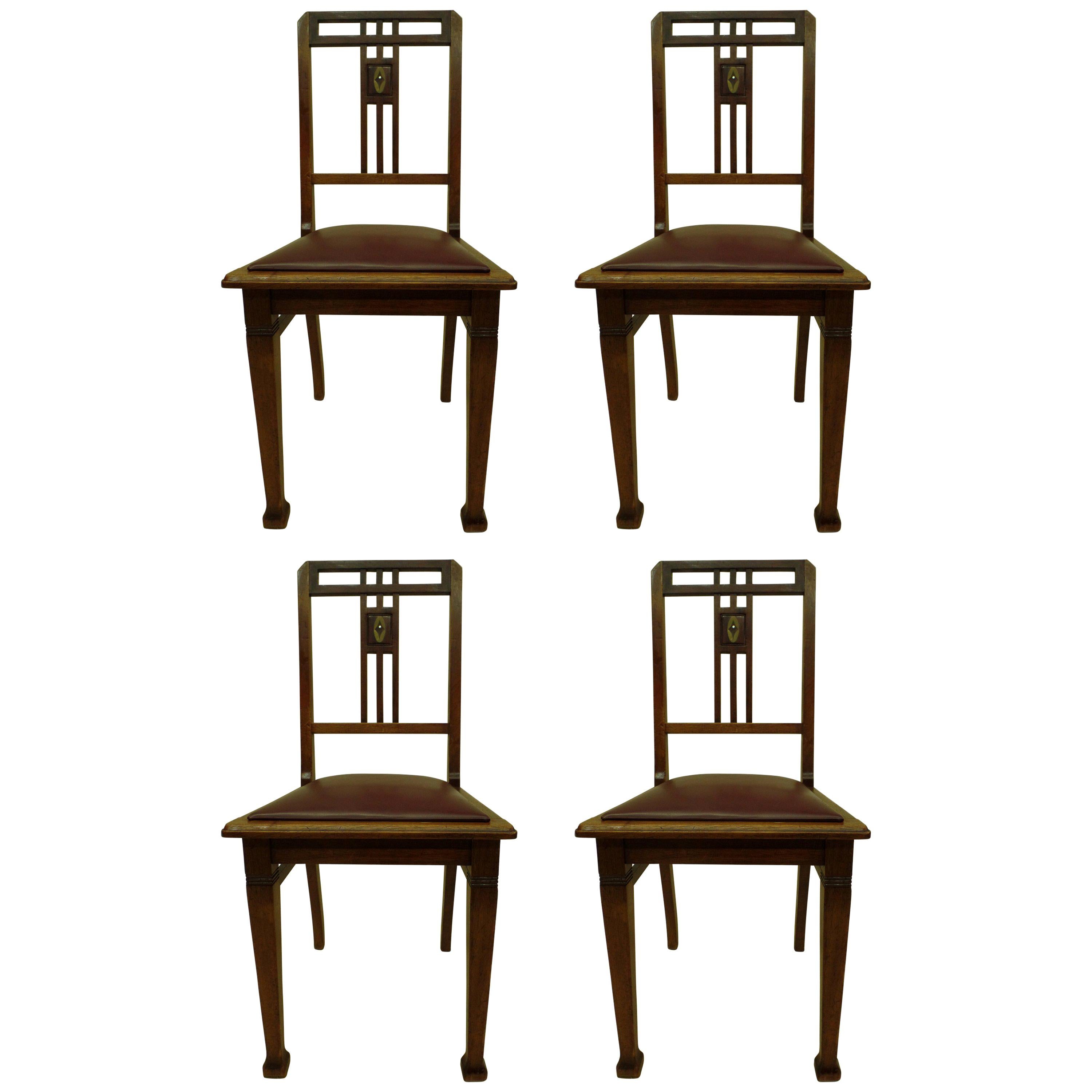 Four French Early Modernist Wood Dining Chairs with Inlaid Brass Grid Back