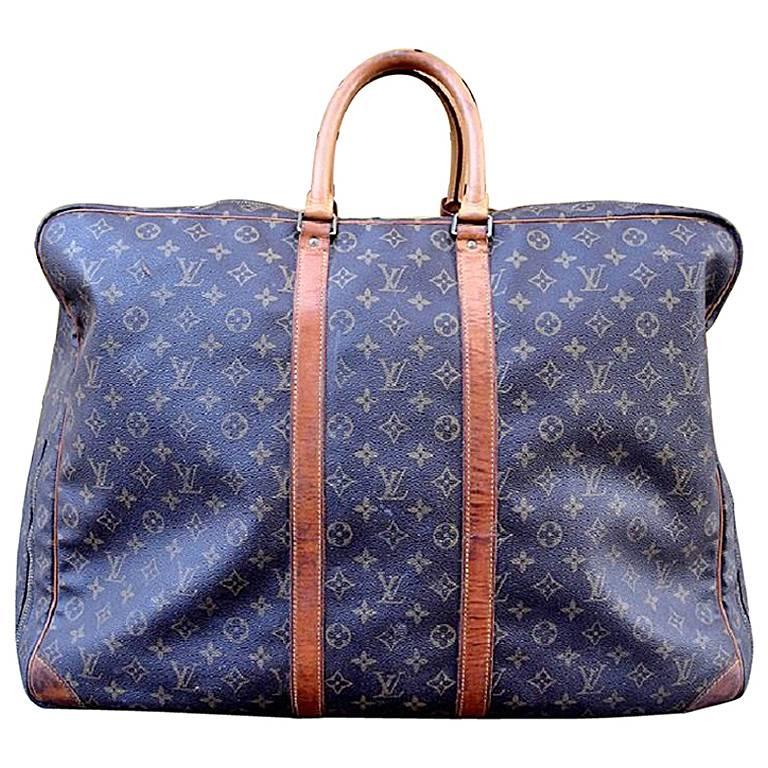 Borsa da viaggio Louis Vuitton "Alize" in tela con monogramma in vendita