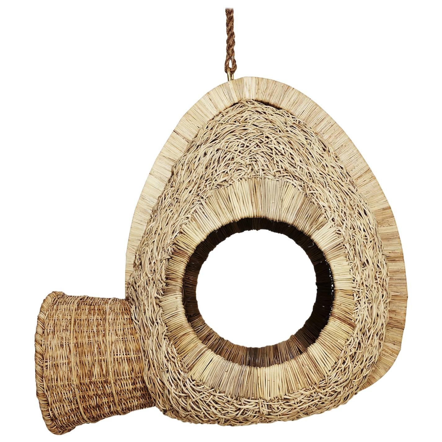 Bwa Leaf Mask Sculptural Hanging Seat in Woven Leather and Kubu Rattan