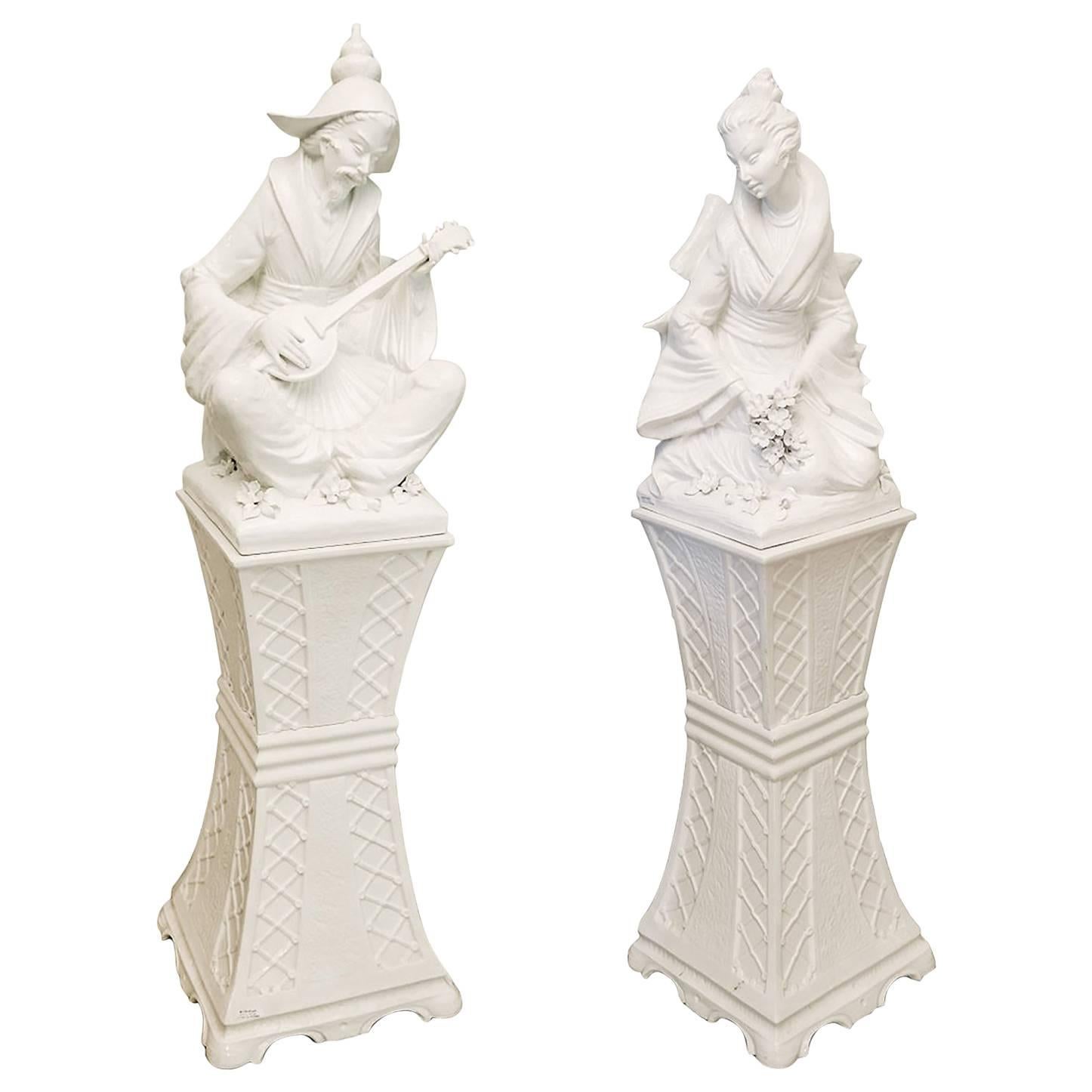 Pair of Large Blanc de Chine Musician and Maiden Figures on Pedestals For Sale
