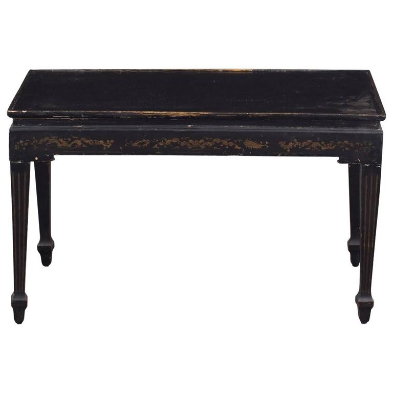 Coffee Swedish Gustavian 18th Century Black a La Chinoiserie Sweden. A coffee table made during the later part of the 18th century a La chinoiserie. Black lacquered finish with gilded details. Tapered and channeled legs.