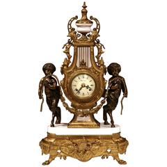 Antique Early 20th Century Italian Carved Bronze and Marble Clock with Patinated Cherubs