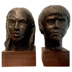 Pair of Plaster Boy and Girl Sculptures