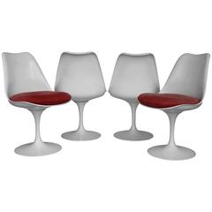 Four Eero Saarinen Tulip Swivel Chairs