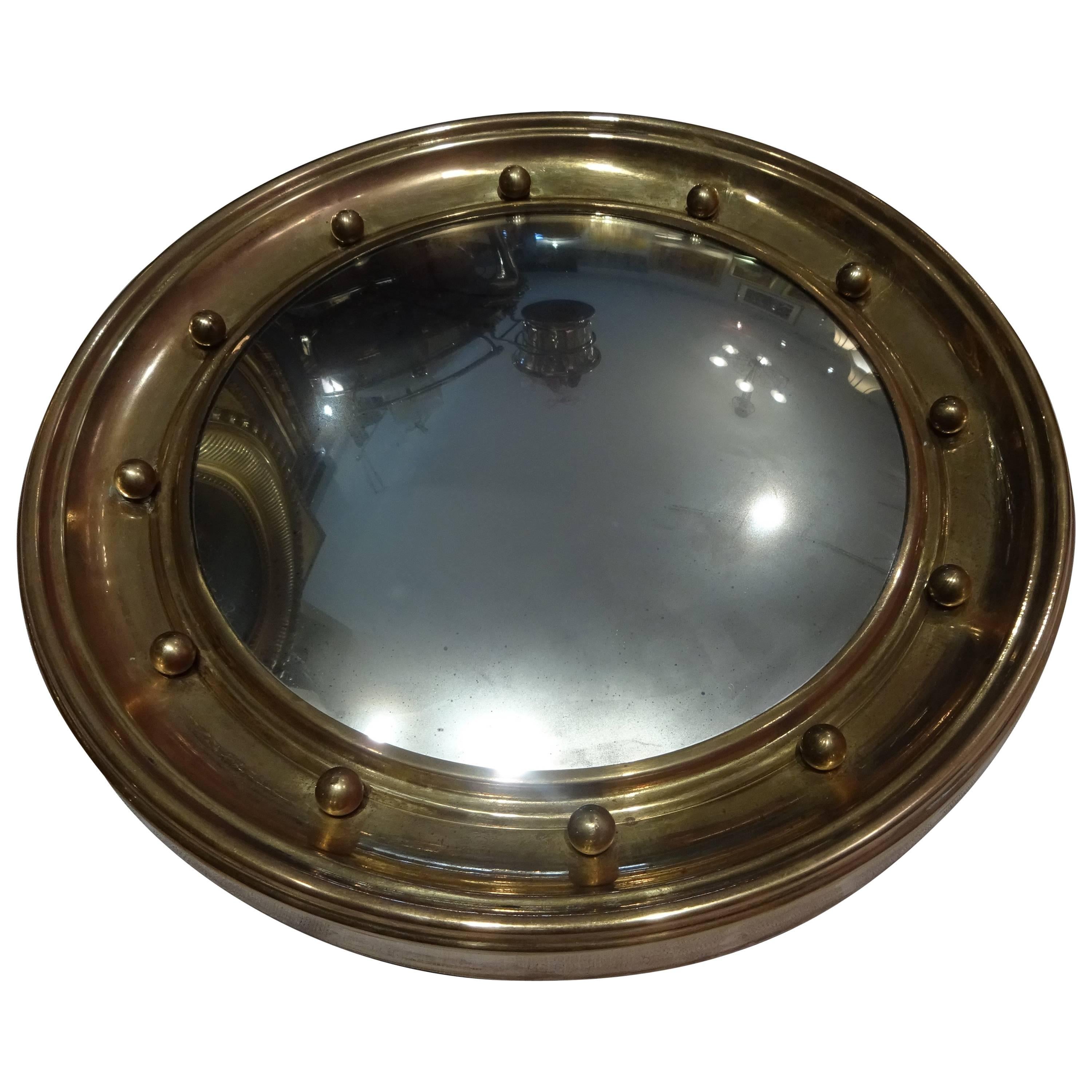 Federal style mirror.
12 fully round balls on molding.
Measures: Diameter 17".
Molding is 2.5" large and 1.5" thick.
Mirror very slightly blurry. Pleasantly witnessing the old age of that mirror. 
Back made of sturdy wood