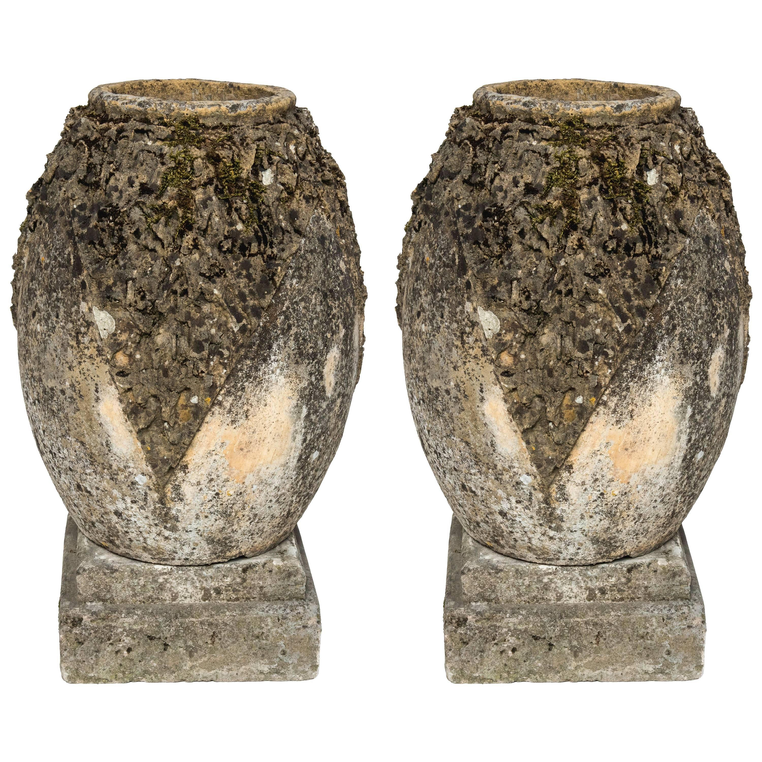 Pair of Striking Cement Normandy Garden Vases with Decorated Sides