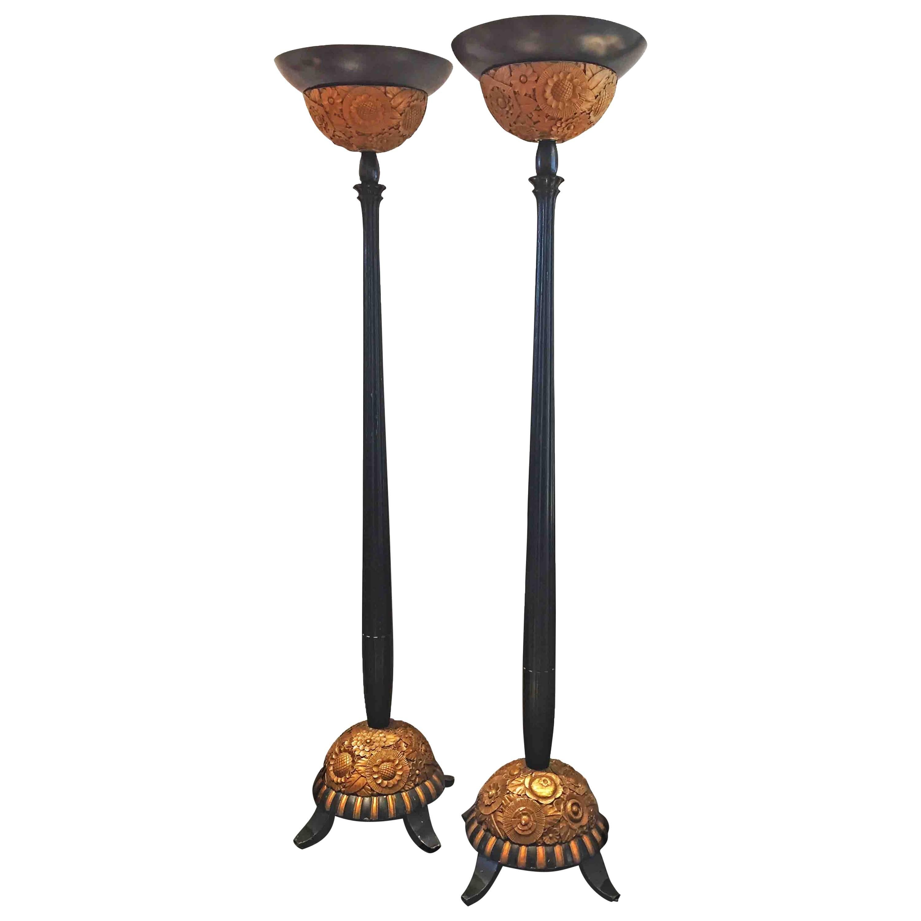 Pair of Black and Gold Art Deco Floor Lamps, Featuring Carved Decorative Bases For Sale