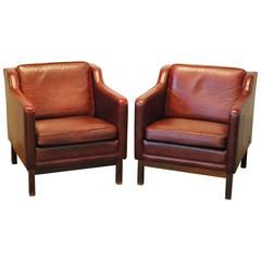 Pair of Mid-Century Modern Oxblood Leather Armchairs