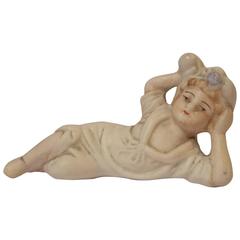 Small Porcelain Statue of a Reclining Woman