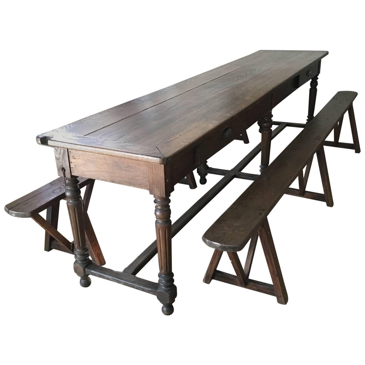 Long French Oak Refectory Table with Center Stretcher and Two Trestle Benches For Sale