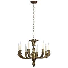 1920s, Bronze Eight-Light Chandelier with Four Grotesques from France