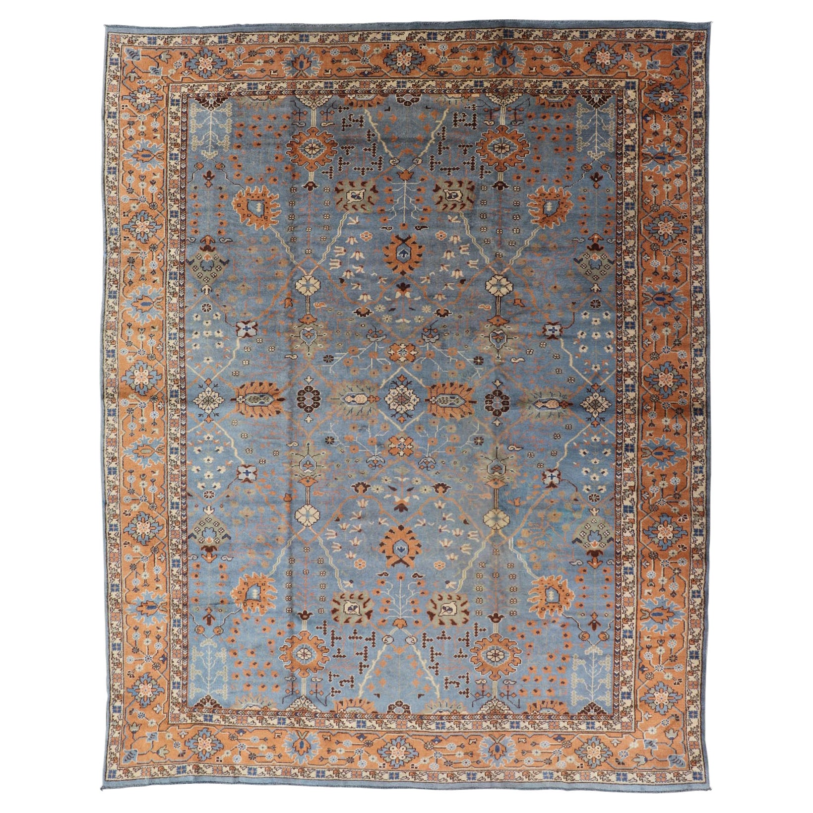 Antique Turkish All Over Oushak Rug in Blue Background by Keivan Woven Arts For Sale