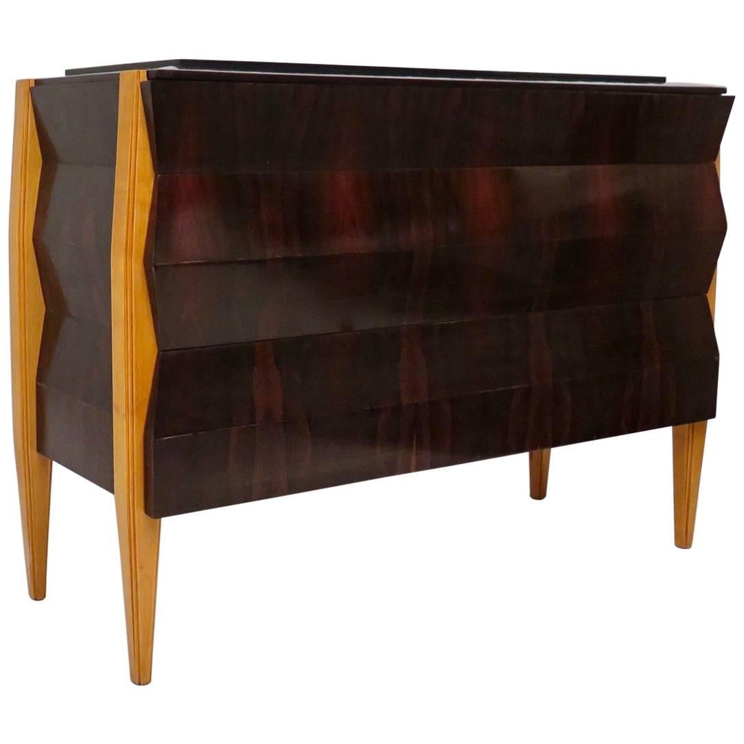 French Art Deco commodes. Body veneered in mahogany stained black, above the top is instead veneered in maple wood. The top above, as you can see from the photos, is raised and the frame all around that welcomes it is slightly oblique compared to