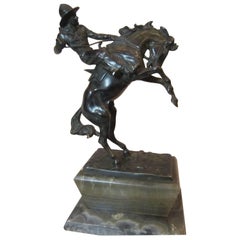 Antique Spirited Bronze Figure of a Cowboy on a Bucking Bronco