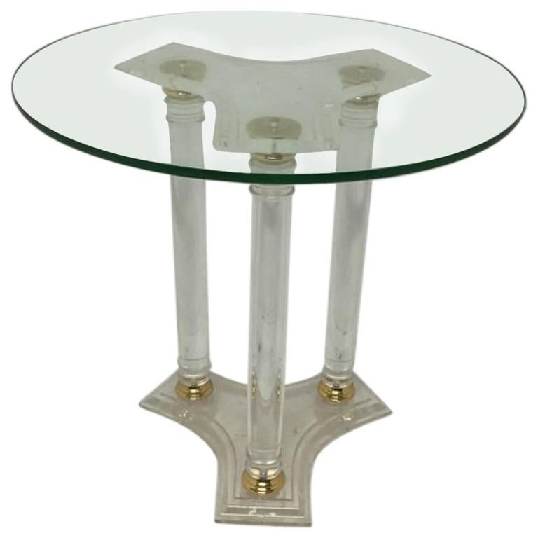 A French Mid-Century Modern Circular Lucite and Brass Side Table.
