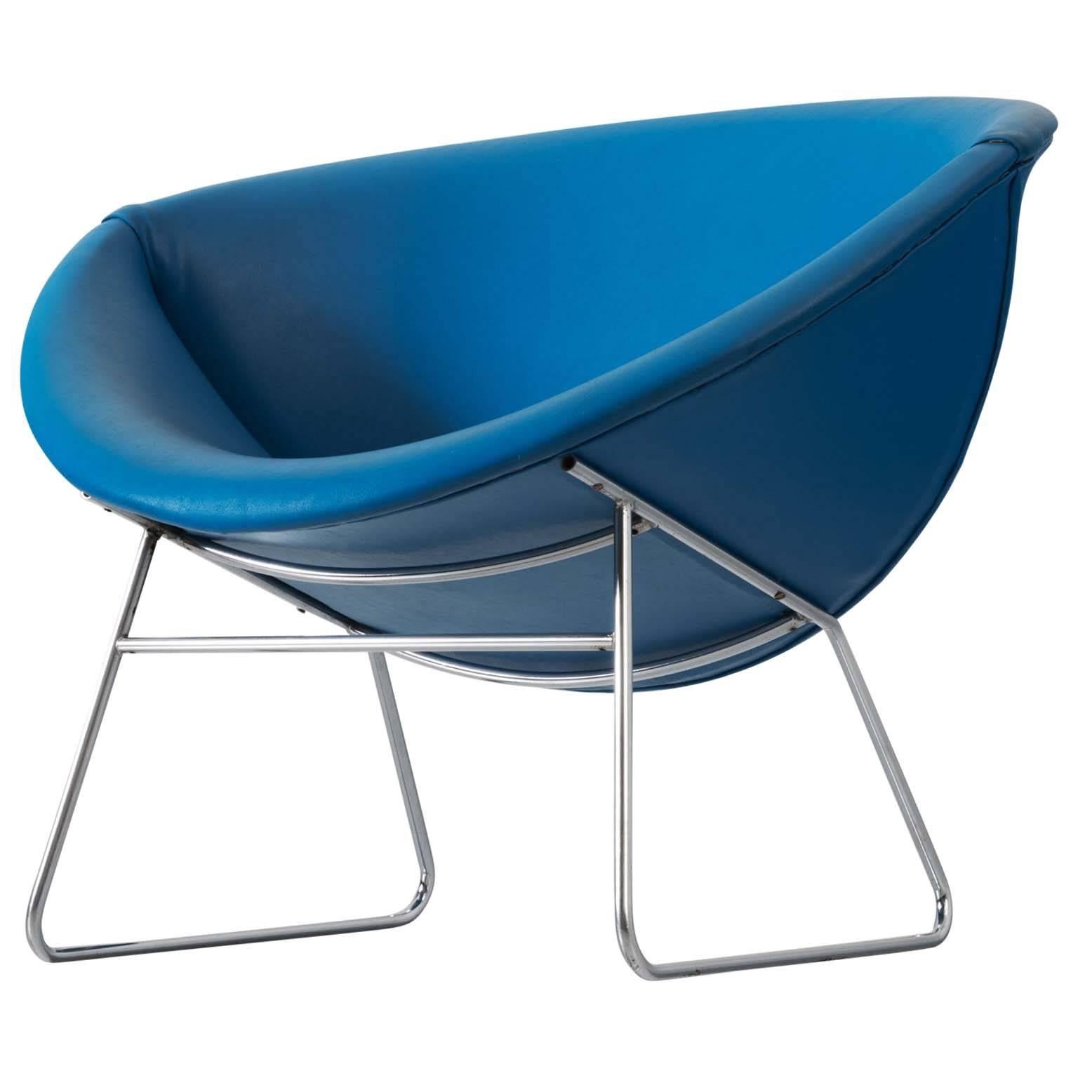 Lounge chair, in metal and faux-leather by Rudolf Wolf for Rohe, the Netherlands 1950s. 

This faux-leather blue chair is a true mid-modern design piece. With its voluptuous lines in the seating yet clean lines on the base it is a truly beautiful