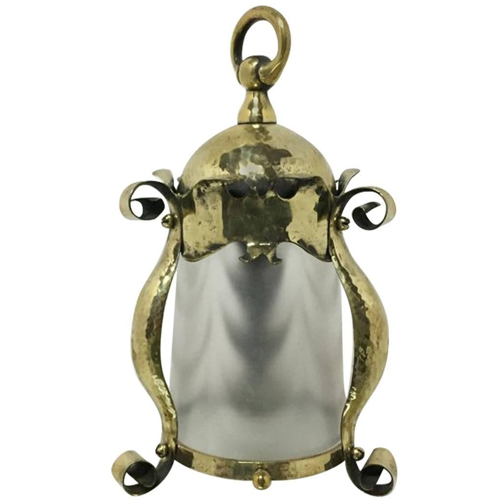 An Arts and Crafts Hammered Brass Lantern with Opaque Ribbed Glass Liner For Sale
