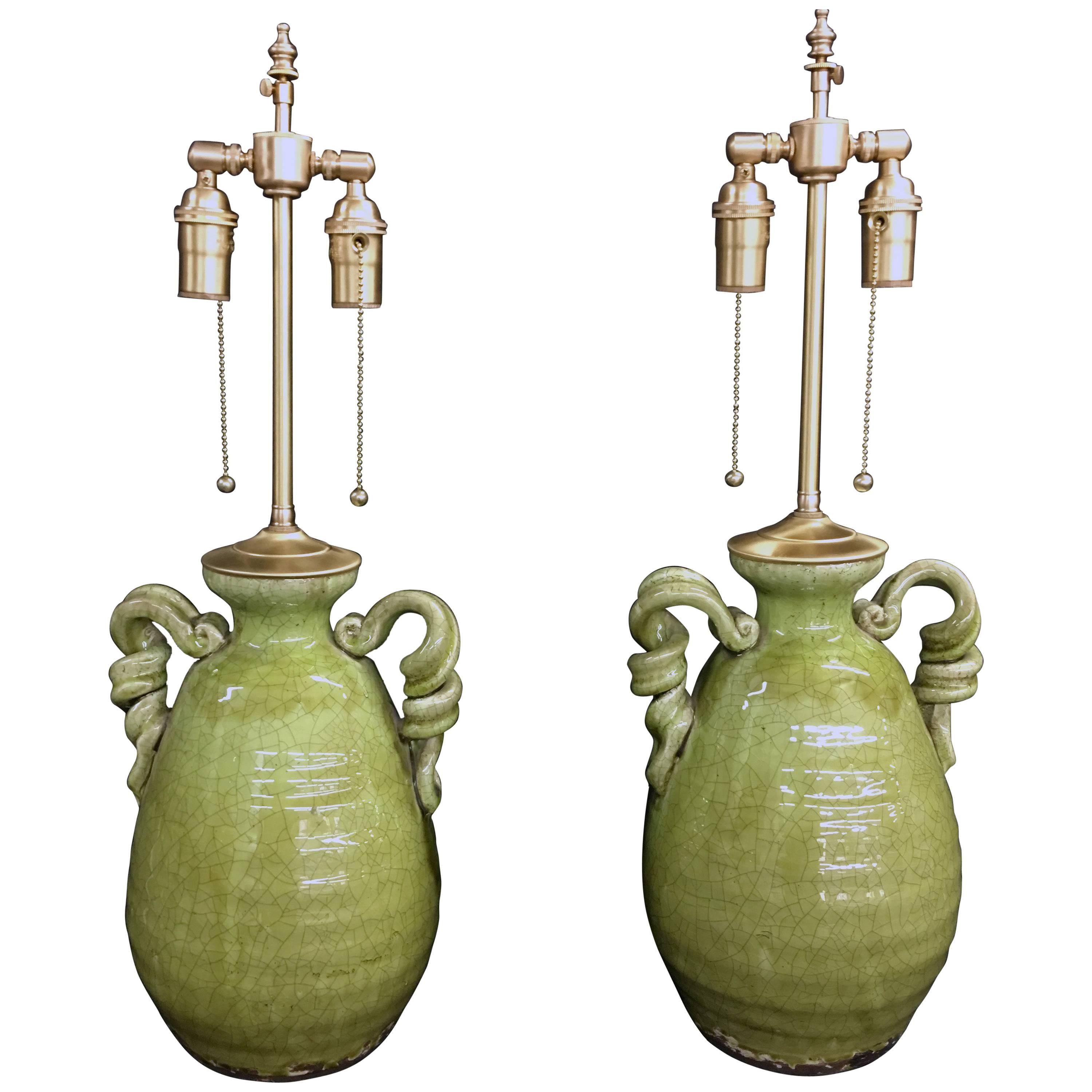 Unusual Pair of Apple Green Crackle Glazed Urns with Lamp Application