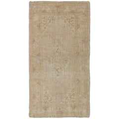 Muted Antique Oushak Carpet with Intricate Design and Defining Border