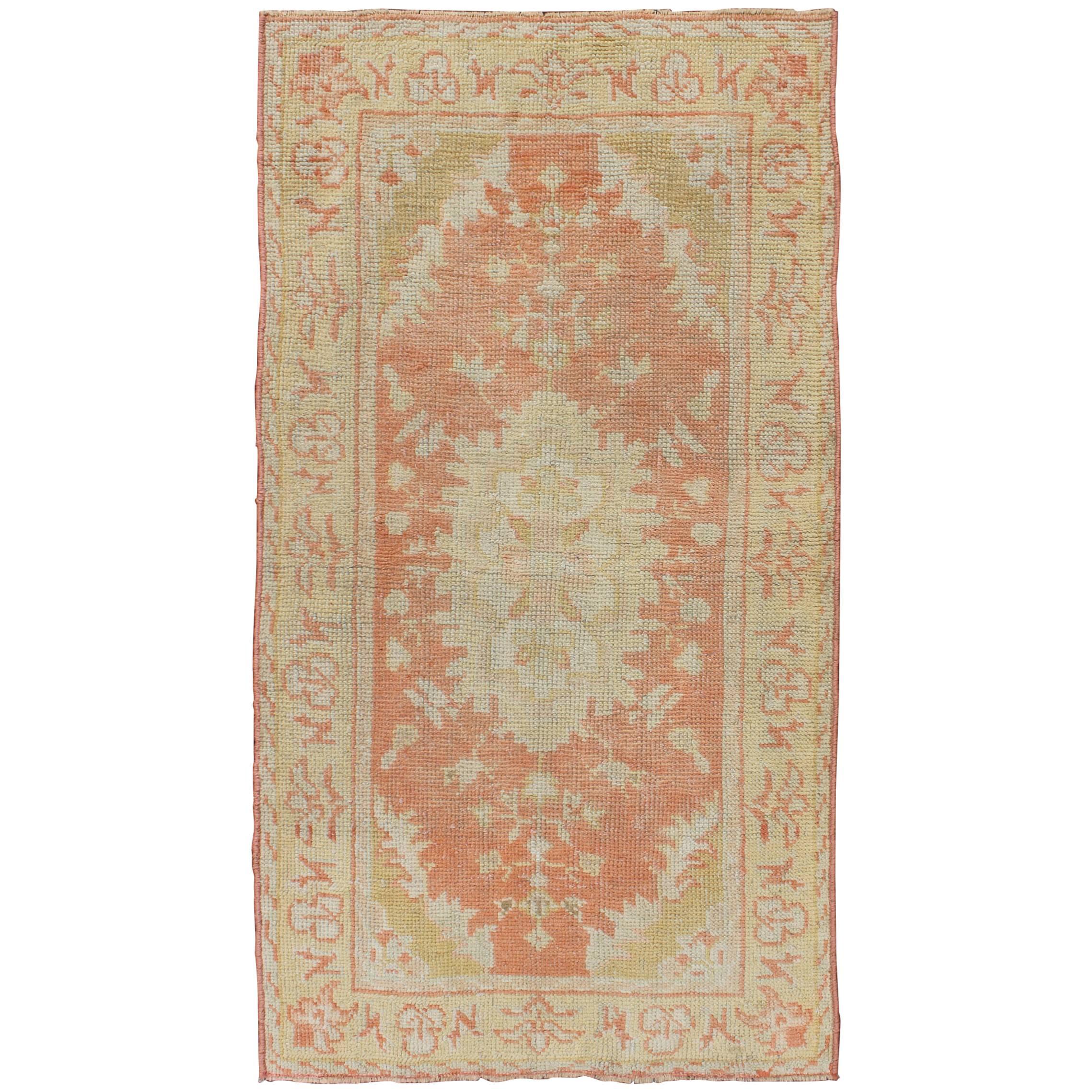 Antique Turkish Oushak Rug with Floral Motifs and Coral Background