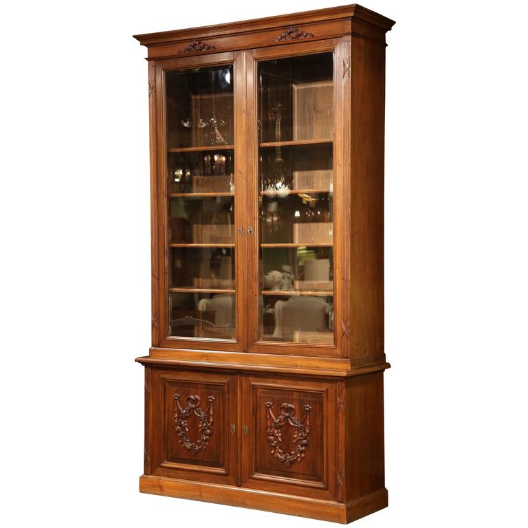 Tall Early 20th Century French Carved Walnut Bookcase With Beveled