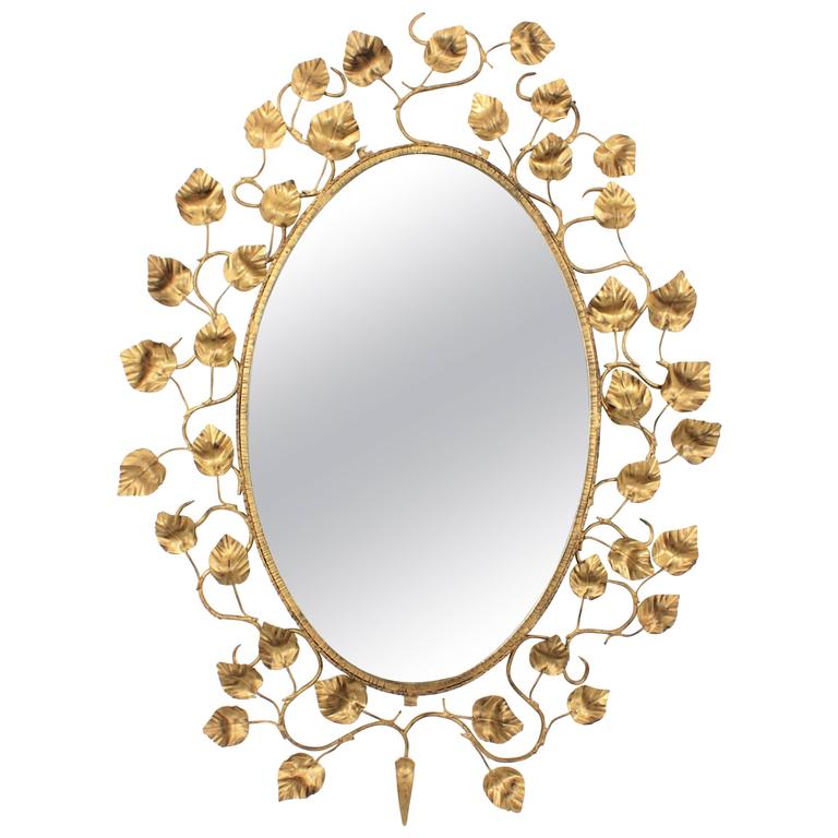 Monumental Spanish 1960s Hand Hammered Gilt Iron Foliate Oval Mirror Monumental Spanish 1960s Hand Hammered Gilt Iron Foliate Oval Mirror For
